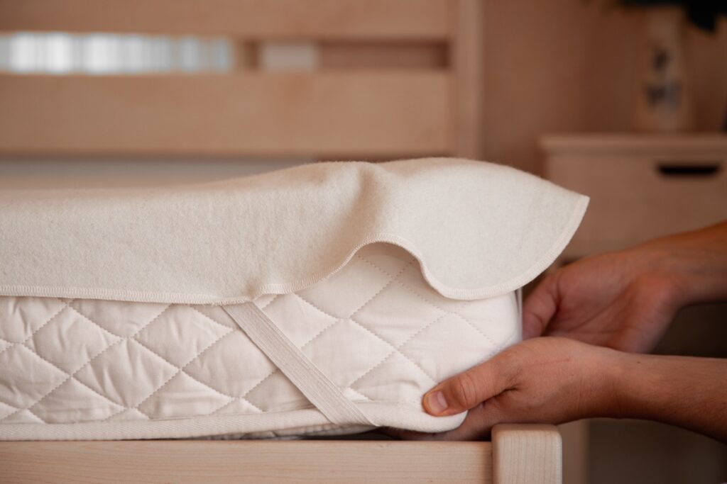 Corinna Black Photography in Jacksonville Beach product photo of a mattress on a bed frame.