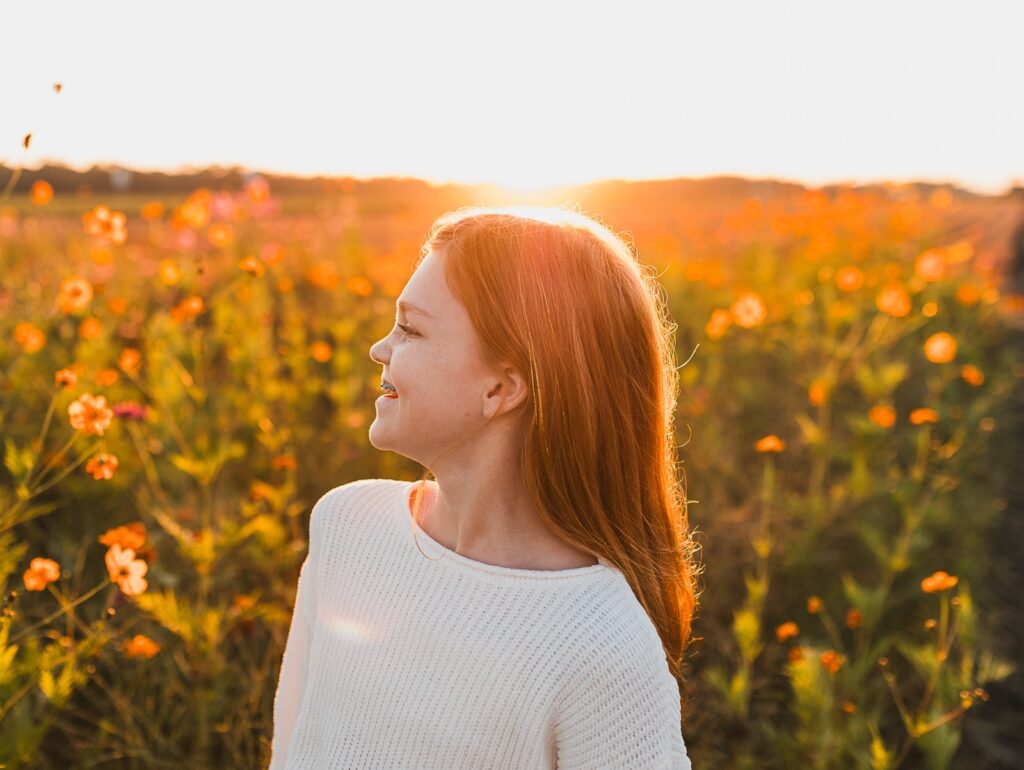 little girl at sunset in a field of flowers at Parker Flower Farm in Elkton, Florida