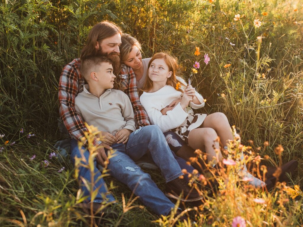 family photo in field of flowers at parker flower farms in elkton, florida