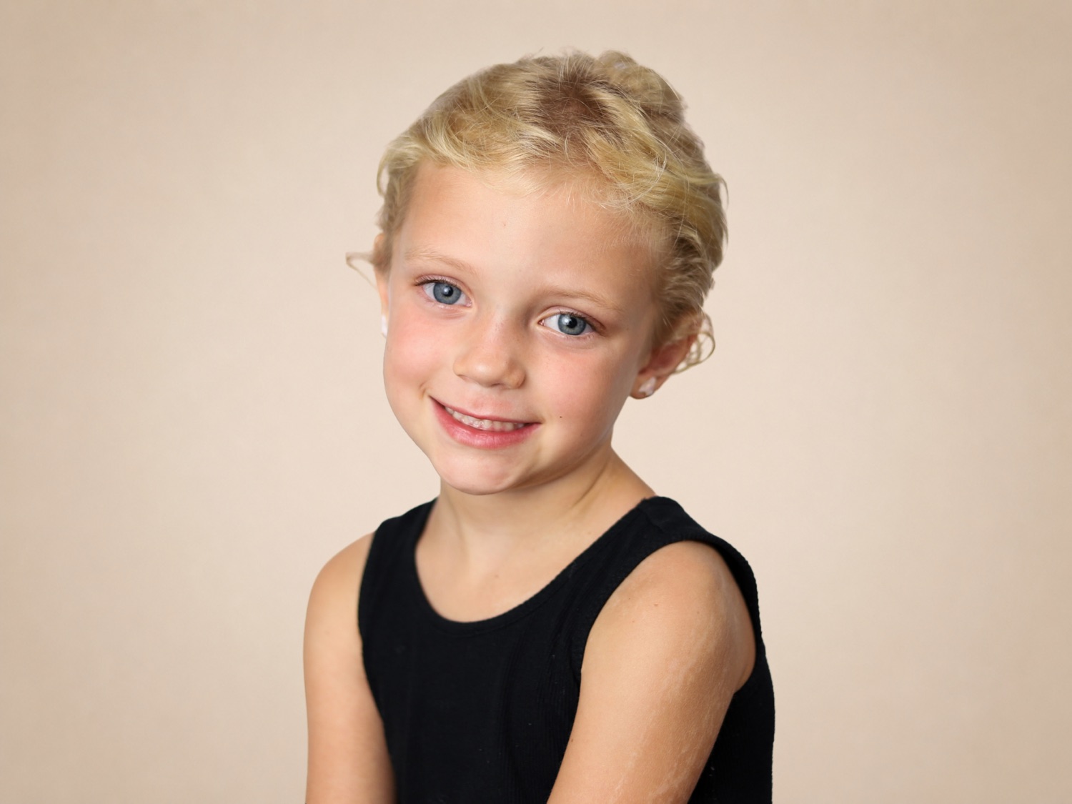 School portrait of preschool student smiling on picture day in Jacksonville, Florida.