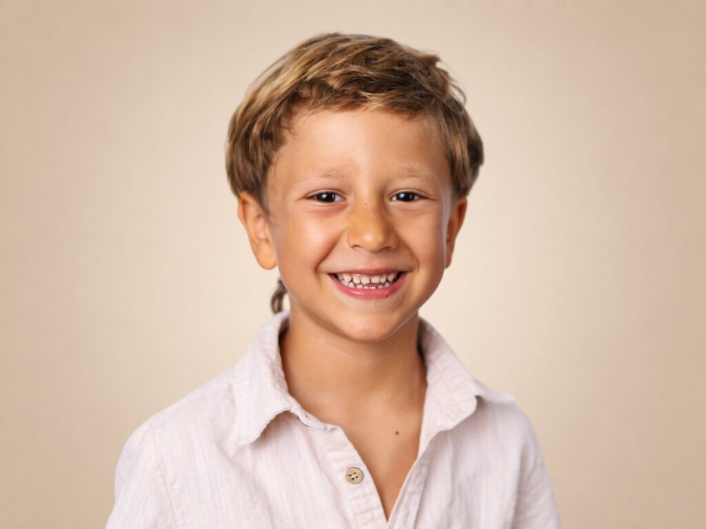 Preschool boy smiles for the camera on picture day in Jacksonville, Florida. 